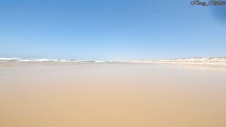 Young Redhead in a Hot Purple Swimsuit with a Huge Ass Playing at the Public Beach.