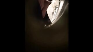 Guys in the urinals taking leak.