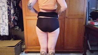 Goth girl lifts her skirt and does a wedgie