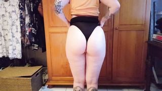 Goth girl lifts her skirt and does a wedgie