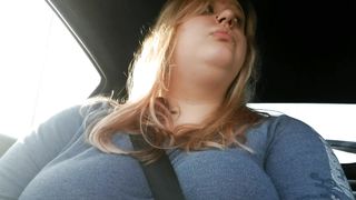 Girl plays with boobs while driving around