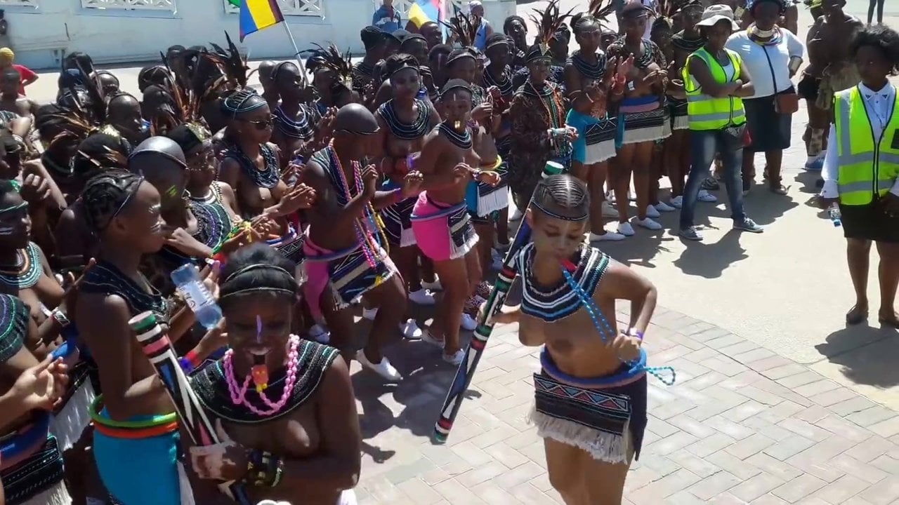 Topless Zulu girls dancing in the street