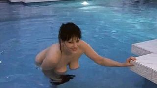 MILF masturbates in pool