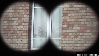 Horny girl has an orgasm as she watches her sexy neighbor strip