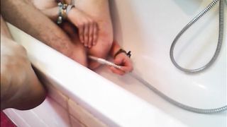 Bi-guy using shower head, squirting water, enema
