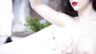 Sexy Brunette Takes a Bubble Bath