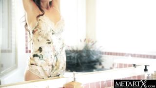 Gorgeous model watches herself in the mirror while masturbating