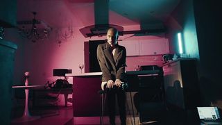 shaved top model undresses on camera and caresses her pussy