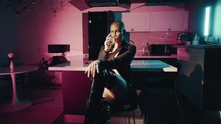 shaved top model undresses on camera and caresses her pussy