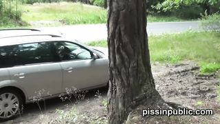 Cute babes are being watched as they get out of their car and pee around