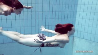 Two sensual babes Lucy and Katrin swimming naked