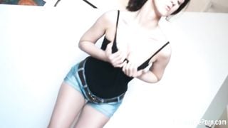 Brunette pleasuring her wet cunt on a mat