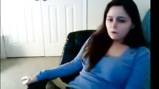 Babe has her hand down her sweat pants masturbating on cam