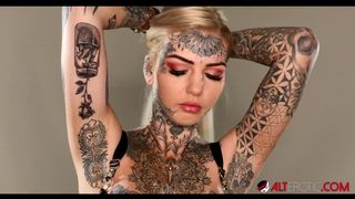 Gorgeous busty Australian babe has her tits tattooed