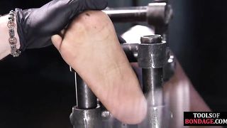 Black BDSM slave bound for foot domination