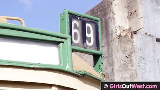 Curvy busty babes lick each other in abandoned tram