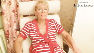 Man Thrusts Fist Deep into Pussy of Mature Blonde