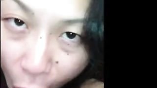 Asian chick sucking black dick with style