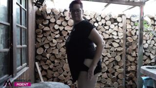 Horny BBW brunette in solo action behind the house