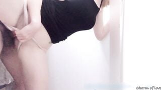 Secretly having sex in the fitting room.