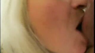 Mature blonde is having fun in the living room