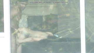 Voyeur cam front of hotel window fuck