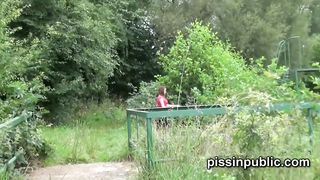 Peeing babes empty their bladders in a park unknowingly being part of voyeur pissing video